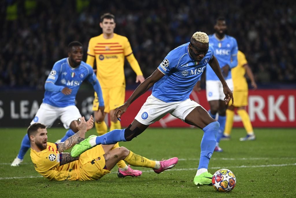 NAPLES, ITALY,FEBRUARY 21: Victor James Osimhen (R), of Napoli, in action during the UEFA Champions League round of 16 first leg football match between Napoli and FC Barcelona at the Diego Armando Maradona stadium in Naples, Italy, on February 21, 2024. (Photo by Isabella Bonotto/Anadolu via Getty Images)