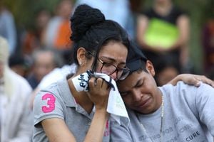 Mourners react during a memorial vigil a day after a deadly incident where 18 pedestrians were hit by a vehicle at a bus stop near Ozanam Center, a shelter for migrants and homeless, killing several, in Brownsville, Texas, U.S. May 8, 2023.  REUTERS/John Faulk NO RESALES. NO ARCHIVES.