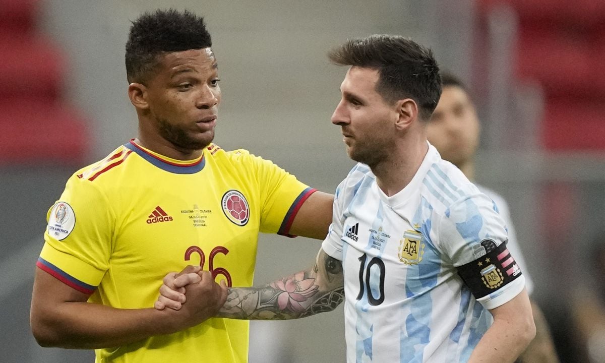 Frank Fabra y Lionel Messi. Foto: AP/Andre Penner