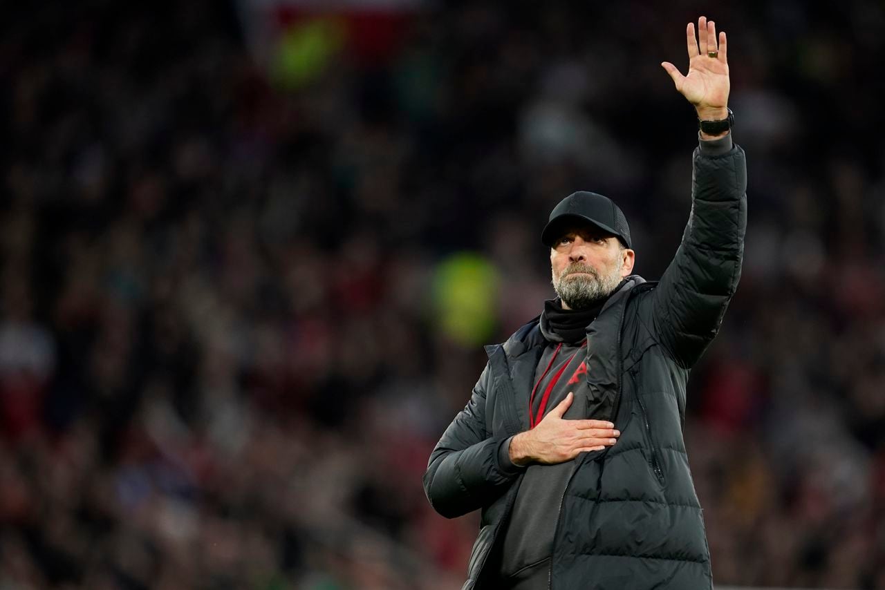 Liverpool's manager Jurgen Klopp greets supporters after the FA Cup quarterfinal soccer match between Manchester United and Liverpool at the Old Trafford stadium in Manchester, England, Sunday, March 17, 2024. Manchester United won 4-3. (AP Photo/Dave Thompson)