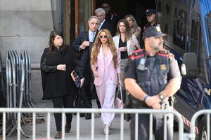 Colombian singer Shakira (C) leaves the High Court of Justice of Catalonia after attending her trial on tax fraud, in Barcelona on November 20, 2023. Colombian superstar Shakira has reached a deal with prosecutors to end her trial for allegedly defrauding the Spanish state of 14.5 million euros ($15.7 million) on income earned between 2012 and 2014, a Barcelona court said. Under the deal, the 46-year-old agreed to receive a three-year suspended sentence in exchange for paying millions of euros in fines, the head of the court said on what would have been the first day of her trial. (Photo by Josep LAGO / AFP)