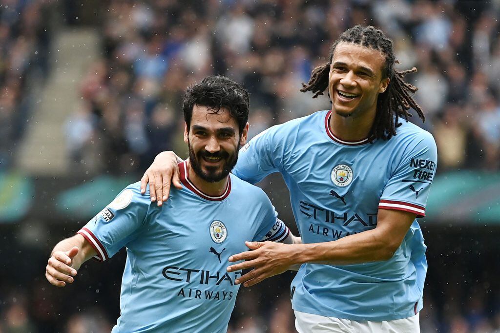 MANCHESTER, ENGLAND - MAY 06: Ilkay Guendogan of Manchester City celebrates with team mate Nathan Ake after scoring their sides second goal during the Premier League match between Manchester City and Leeds United at Etihad Stadium on May 06, 2023 in Manchester, England. (Photo by Gareth Copley/Getty Images)