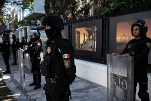 Riot police officers stand guard outside the Ecuadorian embassy in Mexico City on April 6, 2024, following the severance of diplomatic relations between the two countries. Ecuadorian authorities stormed the Mexican embassy in Quito on April 5 to arrest former vice president Jorge Glas, who had been granted political asylum there, prompting Mexico to sever diplomatic ties after the "violation of international law". (Photo by Yuri CORTEZ / AFP)