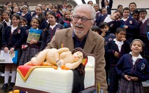 FILE - Colombian artist Fernando Botero laughs next to a cake decorated with a pastry in the likeness of one of his sculptures during his 80th birthday celebration at the Botero Museum in Bogota, Colombia, April 19, 2012. Botero died on Sept. 15, 2023 in Monaco, according to his daughter Lina Botero who confirmed his passing to Colombian radio station Caracol. (AP Photo/William Fernando Martinez, File)