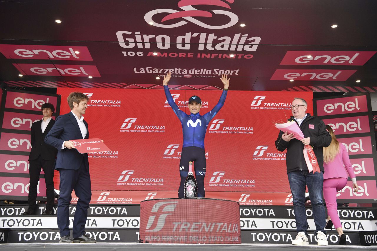 Colombia's Einer Rubio Reyes celebrates on podium winning the 13rd stage of the Giro D'Italia, tour of Italy cycling race, from Borgofranco D'Ivrea to Crans Montana, Friday, May 19, 2023. (Massimo Paolone/LaPresse via AP)