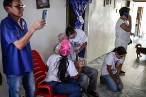 The family of Luis Manuel Díaz waits at their home to reunite with him in Barrancas, Colombia, 
after getting the news that he was released by his kidnappers, Thursday, Nov. 9, 2023. Díaz, the father of Liverpool striker Luis Díaz, whose image stands by the door, was kidnapped on Oct. 28 by the guerrilla group National Liberation Army, or ELN. (AP Photo/Ivan Valencia)