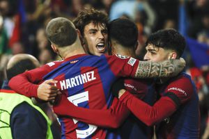 Barcelona's Joao Felix, centre, celebrates with teammates after scoring his side's second goal during the Champions League Group H soccer match between Barcelona and Porto at the Olympic Stadium in Barcelona, Spain, Tuesday, Nov. 28, 2023. (AP Photo/Joan Monfort)