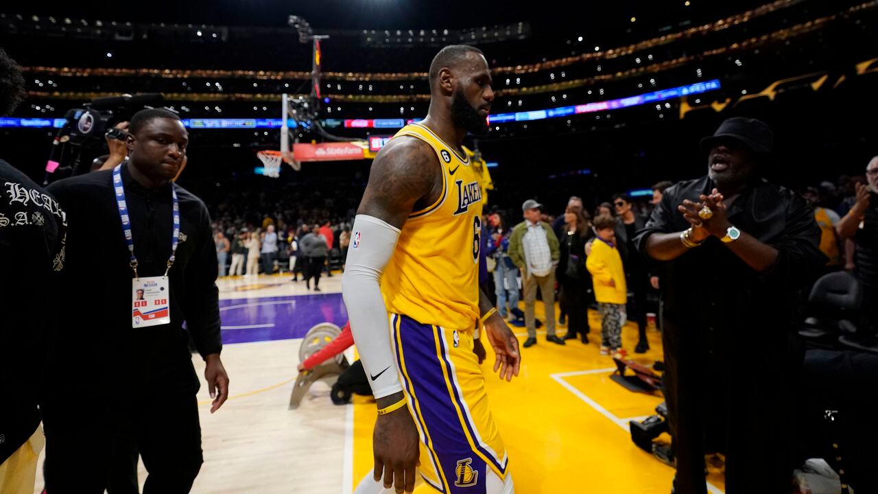 Los Angeles Lakers forward LeBron James walks off the court after a loss to the Denver Nuggets in Game 4 of the NBA basketball Western Conference Final series Monday, May 22, 2023, in Los Angeles. (AP Photo/Ashley Landis)