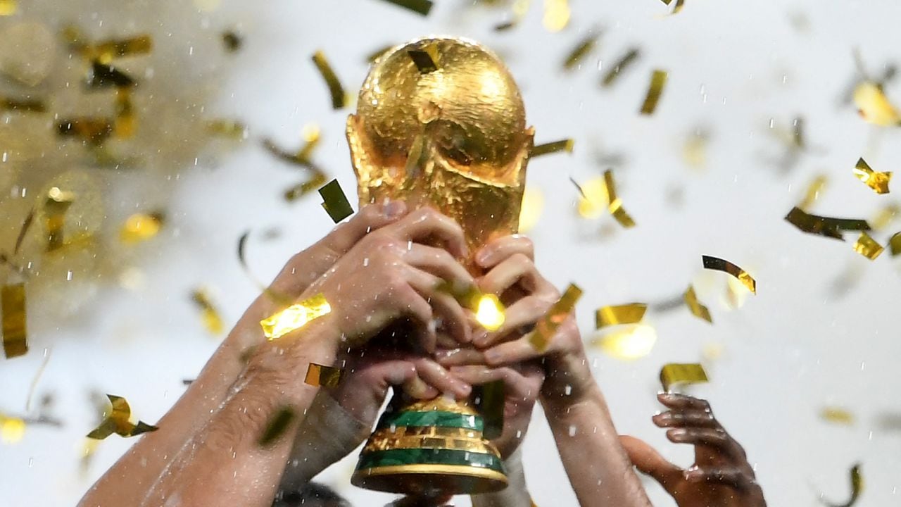FILES) This file photo taken on July 15, 2018 France's players lifting the Fifa World Cup trophy after the Russia 2018 World Cup final football match between France and Croatia at the Luzhniki Stadium in Moscow. Four years after France's victory, football is waiting for its new master at the 2022 World Cup. But the contenders, Brazil, Argentina and France, are afraid of getting bogged down in the atypical World Cup in Qatar, which promises to be full of surprises.
AFP/Jewel SAMAD