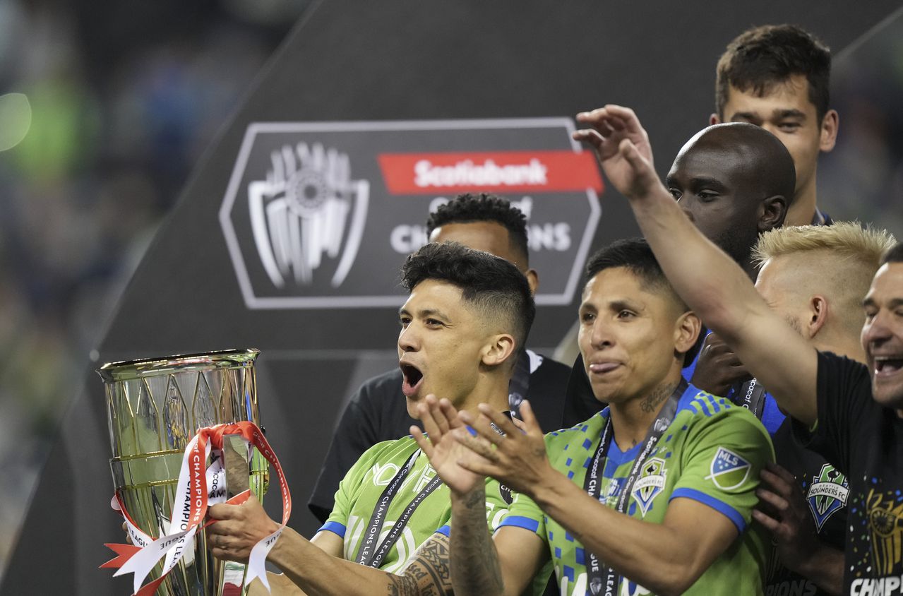 SEATTLE, WA - MAY 04: Seattle Sounders forward Fredy Montero (12) reacts while holding the CONCACAF trophy after the CONCACAF Champions League Final match between the Seattle Sounders and Pumas UNAM on May 4, 2022 at Lumen Field in Seattle, WA.  (Photo by Jeff Halstead/Icon Sportswire via Getty Images)