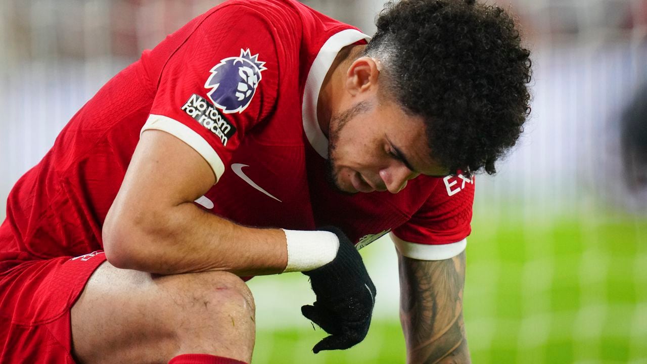 Liverpool's Luis Diaz is dejected after failing to score during the English Premier League soccer match between Liverpool and Luton Town, at Anfield stadium in Liverpool, England, Wednesday, Feb. 21, 2024. (AP Photo/Jon Super)