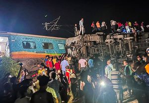 MANDATORY CREDIT- Rescuers work at the site of passenger trains that derailed in Balasore district, in the eastern Indian state of Orissa, Friday, June 2, 2023. Two passenger trains derailed in India, killing at least 13 people and trapping hundreds of others inside more than a dozen damaged coaches, officials said. About 400 people were injured and taken to hospitals, and the cause of the accident was under investigation, officials said. (Press Trust of India via AP)