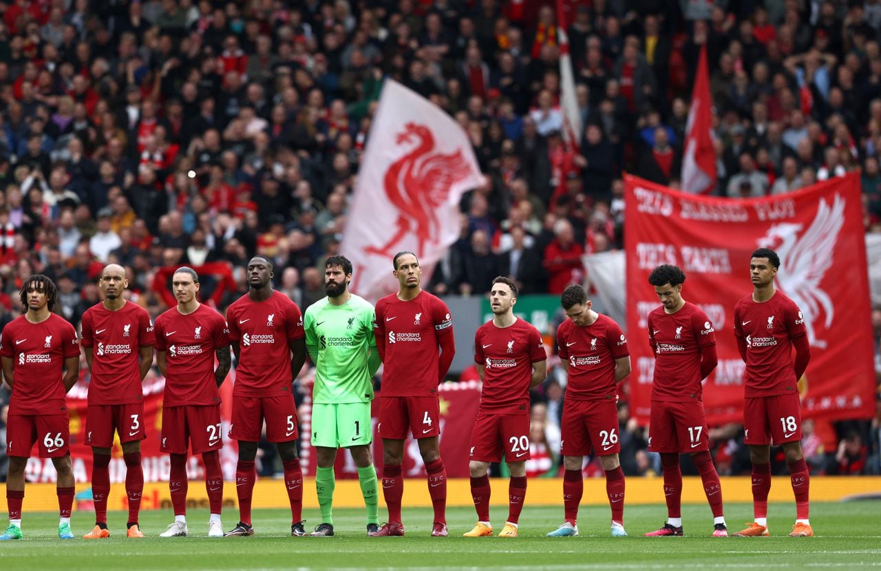 Liverpool's players sing the national anthem prior to the English Premier League football match between Liverpool and Brentford at Anfield in Liverpool, north west England on May 6, 2023. (Photo by DARREN STAPLES / AFP) / RESTRICTED TO EDITORIAL USE. No use with unauthorized audio, video, data, fixture lists, club/league logos or 'live' services. Online in-match use limited to 120 images. An additional 40 images may be used in extra time. No video emulation. Social media in-match use limited to 120 images. An additional 40 images may be used in extra time. No use in betting publications, games or single club/league/player publications. /
