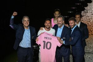 Argentine soccer star Lionel Messi (2nd L) is presented by (from R) owners of Inter Miami CF David Beckham, Jose R. Mas and Jorge Mas as the newest player for Major League Soccer's Inter Miami CF, at DRV PNK Stadium in Fort Lauderdale, Florida, on July 16, 2023. (Photo by GIORGIO VIERA / AFP)