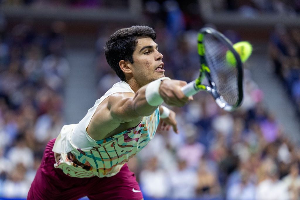 NEW YORK, USA:  September 8:  Carlos Alcaraz of Spain stretches to reach a serve from Daniil Medvedev of Russia in the Men's Singles Semi-Final match on Arthur Ashe Stadium during the US Open Tennis Championship 2023 at the USTA National Tennis Centre on September 8th, 2023 in Flushing, Queens, New York City.  (Photo by Tim Clayton/Corbis via Getty Images)