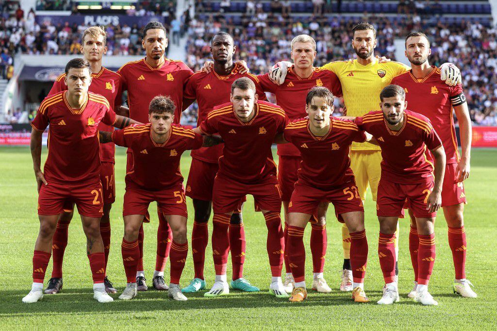 (Back row L-R) AS Roma's Spanish defender Diego Llorente, AS Roma's British defender Chris Smalling, AS Roma's Cameroonian defender Obite Evan Ndicka, AS Roma's Danish defender Rasmus Christensen, AS Roma's Portuguese goalkeeper Rui Patricio, AS Roma's Italian midfielder Bryan Cristante, (Front row L-R) AS Roma's Argentinian forward Paulo Dybala, AS Roma's Polish forward Nicola Zalewski, AS Roma's Italian forward Andrea Belotti, AS Roma's Italian midfielder Edoardo Bove, and AS Roma's Algerian midfielder Houssem Aouar pose for photographs ahead of a friendly football match between Toulouse (TFC) and AS Roma (ASR) at Stadium TFC in Toulouse, southwestern France, on August 6, 2023. (Photo by Charly TRIBALLEAU / AFP)