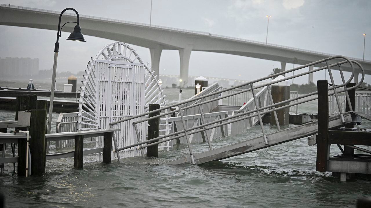 A boardwalk at the Clearwater Harbor Marina in Clearwater, Florida, is flooded by the rising tide on August 30, 2023, after Hurricane Idalia made landfall. Idalia barreled into the northwest Florida coast as a powerful Category 3 hurricane on Wednesday morning, the US National Hurricane Center said. "Extremely dangerous Category 3 Hurricane #Idalia makes landfall in the Florida Big Bend," it posted on X, formerly known as Twitter, adding that Idalia was causing "catastrophic storm surge and damaging winds." (Photo by Miguel J. Rodriguez Carrillo / AFP)