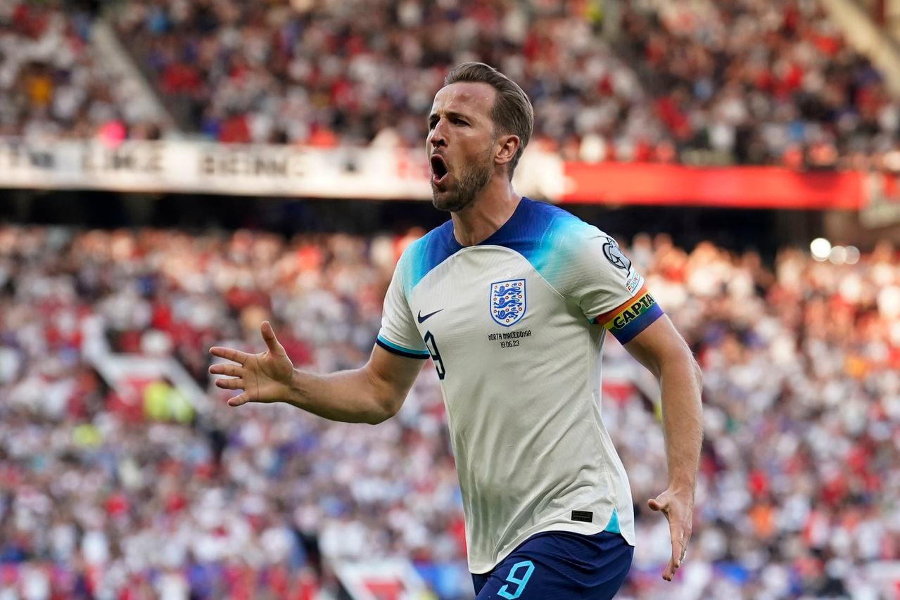 England's Harry Kane celebrates after scoring the opening goal during the Euro 2024 group C qualifying soccer match between England and North Macedonia at Old Trafford in Manchester, Monday June 19, 2023. (AP Photo/Dave Thompson)