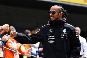 SPA, BELGIUM - JULY 30: Lewis Hamilton of Great Britain and Mercedes-AMG PETRONAS F1 Team fistbumps a marshall before the F1 Grand Prix of Belgium at Circuit de Spa-Francorchamps on July 30, 2023 in Spa, Belgium. (Photo by Qian Jun/MB Media/Getty Images)