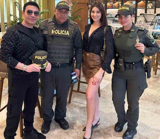 Fereidoun junto a su novia colombiana y la Policía Nacional
