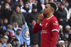 Liverpool's Trent Alexander-Arnold celebrates after scoring his side's opening goal during the English Premier League soccer match between Manchester City and Liverpool at Etihad stadium in Manchester, England, Saturday, Nov. 25, 2023. (AP Photo/Rui Vieira)