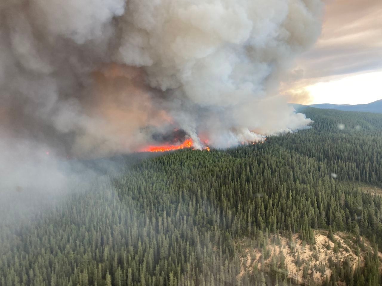 This undated handout photo provided by the British Columbia Wildfire Service on July 10, 2023, shows an aerial view of the Little Blue River wildfire, located approximately 40km (24.85 miles) south of Yukon, Canada. The number of forest fires continues to rise in Canada, climbing on July 7, 2023, to more than 670 blazes -- more than 380 of them out of control -- with a long and difficult summer ahead. With nine million hectares (22.2 million acres) already gone up in smoke -- 11 times the average for the last decade -- the absolute annual record set in 1989 has been surpassed. (Photo by BC Wildfire Service / AFP) / RESTRICTED TO EDITORIAL USE - MANDATORY CREDIT "AFP PHOTO / BC Wildfire Service / Handout" - NO MARKETING NO ADVERTISING CAMPAIGNS - DISTRIBUTED AS A SERVICE TO CLIENTS