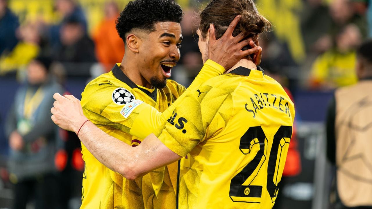 DORTMUND, GERMANY - APRIL 16: Marcel Sabitzer of Borussia Dortmund celebrates after scoring the team's fourth goal with Ian Maatsen of Borussia Dortmund during the Quarter-final Second Leg - UEFA Champions League 2023/24 match between Borussia Dortmund and Atletico Madrid at Signal Iduna Park on April 16, 2024 in Dortmund, Germany. (Photo by Joris Verwijst/BSR Agency/Getty Images)