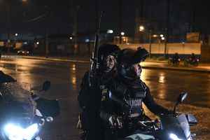 Members of a special motorized unit of the National Police participate in a manhunt after the escape of several prisoners from the Litoral penitentiary in Guayaquil, Ecuador on January 13, 2024. At least five prisoners escaped from a prison in Guayaquil, according to police leading the chase by land and air that followed the escape, which occurred in the midst of one of the worst drug attacks in Ecuador. (Photo by Yuri CORTEZ / AFP)