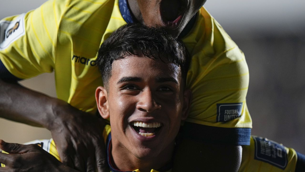 Ecuador's Kendry Paez, bottom, celebrates after scoring the opening goal against Bolivia during a qualifying soccer match for the FIFA World Cup 2026 at Hernando Siles stadium in La Paz, Bolivia, Thursday, Oct. 12, 2023.(AP Photo/Juan Karita)