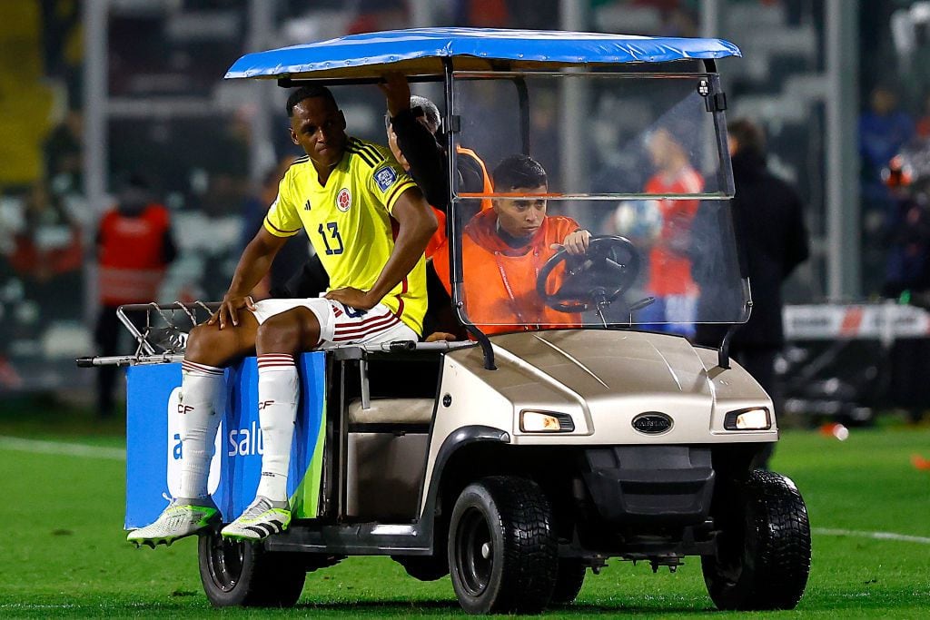 SANTIAGO, CHILE - SEPTEMBER 12: Yerry Mina of Colombia leaves the pitch after being injured during a FIFA World Cup 2026 Qualifier match between Chile and Colombia at Estadio Monumental David Arellano on September 12, 2023 in Santiago, Chile. (Photo by Marcelo Hernandez/Getty Images)