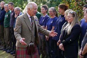 Britain's King Charles III, and Queen Camilla, meet estate staff as they leave Crathie Parish Church, after a church service, to mark the first anniversary of the death of Queen Elizabeth II, near Balmoral, Scotland, Friday, Sept. 8, 2023. (Andrew Milligan/Pool Photo via AP)