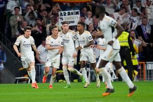 Real Madrid's Lucas Vazquez, second left, celebrates with his teammates after scoring his side's second goal during the Spanish La Liga soccer match between Real Madrid and Barcelona at the Santiago Bernabeu stadium in Madrid, Spain, Sunday, April 21, 2024. (AP Photo/Manu Fernandez)
