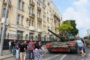 Members of Wagner group sit atop of a tank in a street in the city of Rostov-on-Don, on June 24, 2023. President Vladimir Putin on June 24, 2023 said an armed mutiny by Wagner mercenaries was a "stab in the back" and that the group's chief Yevgeny Prigozhin had betrayed Russia, as he vowed to punish the dissidents. Prigozhin said his fighters control key military sites in the southern city of Rostov-on-Don. (Photo by STRINGER / AFP)