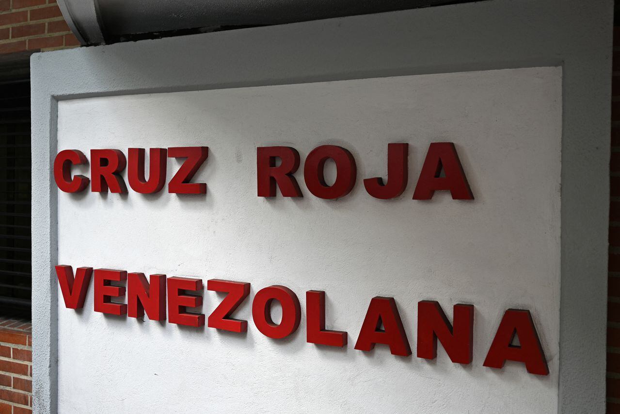 View of the Venezuelan Red Cross logo at its headquarters in Caracas on August 9, 2023. The Venezuelan Supreme Court of Justice (TSJ) ordered the dismissal of the board of directors of the local Red Cross and appointed a new "Ad Hoc" president following the initiation of an investigation against the director, Mario Villarroel, accused of mistreating workers. (Photo by Federico PARRA / AFP)