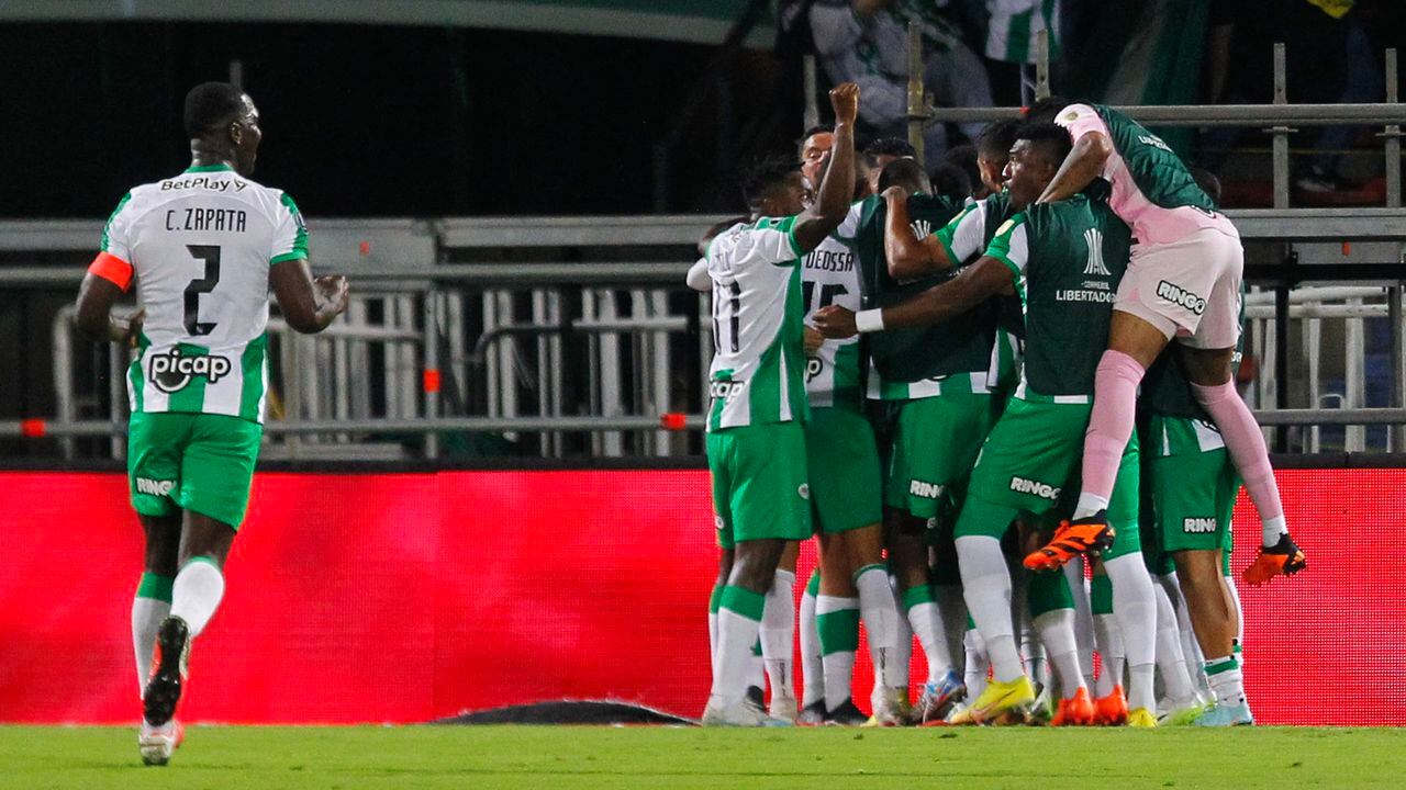 Players of Atletico Nacional celebrate after scoring during the Copa Libertadores round of 16 first leg football match between Colombia's Atletico Nacional and Argentina's Racing Club at the Atanasio Girardot stadium in Medellin, Colombia, on August 3, 2023. (Photo by Fredy BUILES / AFP)