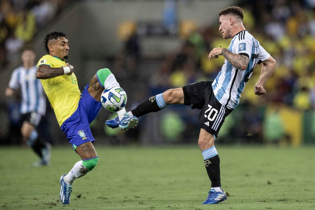 RIO DE JANEIRO, BRAZIL - NOVEMBER 21: Alexis Mac Allister of Argentina (R) battles for the ball with Raphinha Dias of Brazil (L) during FIFA World Cup 2026 Qualifier match between Brazil and Argentina at Maracana Stadium on November 21, 2023 in Rio de Janeiro, Brazil. (Photo by Marco Galvão/Eurasia Sport Images/Getty Images)