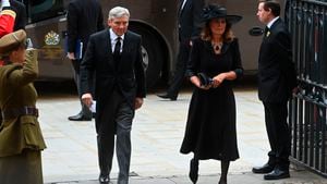 Michael and Carole Middleton arrive for the funeral service of Queen Elizabeth II at Westminster Abbey in central London, Monday Sept. 19, 2022. The Queen, who died aged 96 on Sept. 8, will be buried at Windsor alongside her late husband, Prince Philip, who died last year. (Geoff Pugh/Pool via AP)