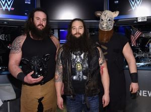 NEW YORK, NY - MARCH 29: WWE Superstars Braun Strowman, Bray Wyatt and Erick Rowan ring The New York Stock Exchange Opening Bell in honor of WrestleMania 32 at New York Stock Exchange on March 29, 2016 in New York City.   Jamie McCarthy/Getty Images/AFP (Photo by Jamie McCarthy / GETTY IMAGES NORTH AMERICA / Getty Images via AFP)