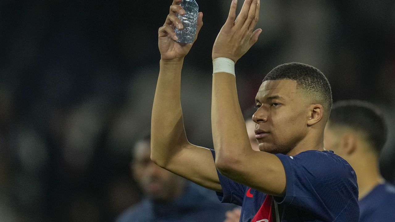 PSG's Kylian Mbappe celebrates at the end of the Champions League round of 16 first leg soccer match between Paris Saint-Germain and Real Sociedad, at the Parc des Princes stadium in Paris, France, Wednesday, Feb. 14, 2024. (AP Photo/Christophe Ena)