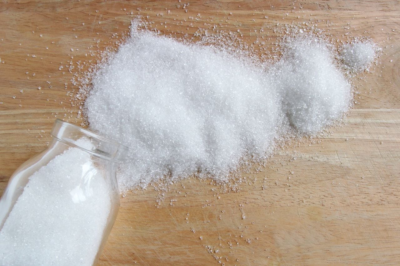 white sugar on wood table