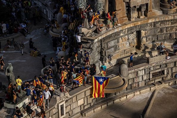 Catalans with independence flags at Plaza de Espana on Catalonia's National Day, 'La Diada', in Barcelona, Spain, on Monday, Sept. 11, 2023. After an inconclusive general election in July, Catalan separatist leader Carles Puigdemont's small Junts party came out of near national irrelevance to hold the keys to finding a new administration for the euro area's fourth largest economy. Photographer: Angel Garcia/Bloomberg via Getty Images