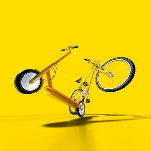 Mountain bike and electric push scooter on yellow background