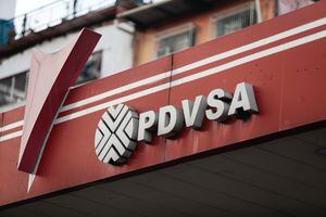 28 March 2023, Venezuela, Caracas: The logo of the state oil company PDVSA is seen at a gas station. According to current knowledge, the South American crisis state has the largest oil reserves in the world. However, due to sanctions, mismanagement and corruption, the daily production volume is below potential. Photo: Pedro Rances Mattey/ (Photo by Pedro Rances Mattey/picture alliance via Getty Images)