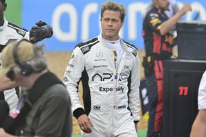 Actor Brad Pitt walks through the paddock before before the British Formula One Grand Prix race at the Silverstone racetrack, Silverstone, England, Sunday, July 9, 2023. Production of Brad Pitt and Lewis Hamilton's F1 movie has begun at Silverstone. (Christian Bruna/Pool photo via AP)
