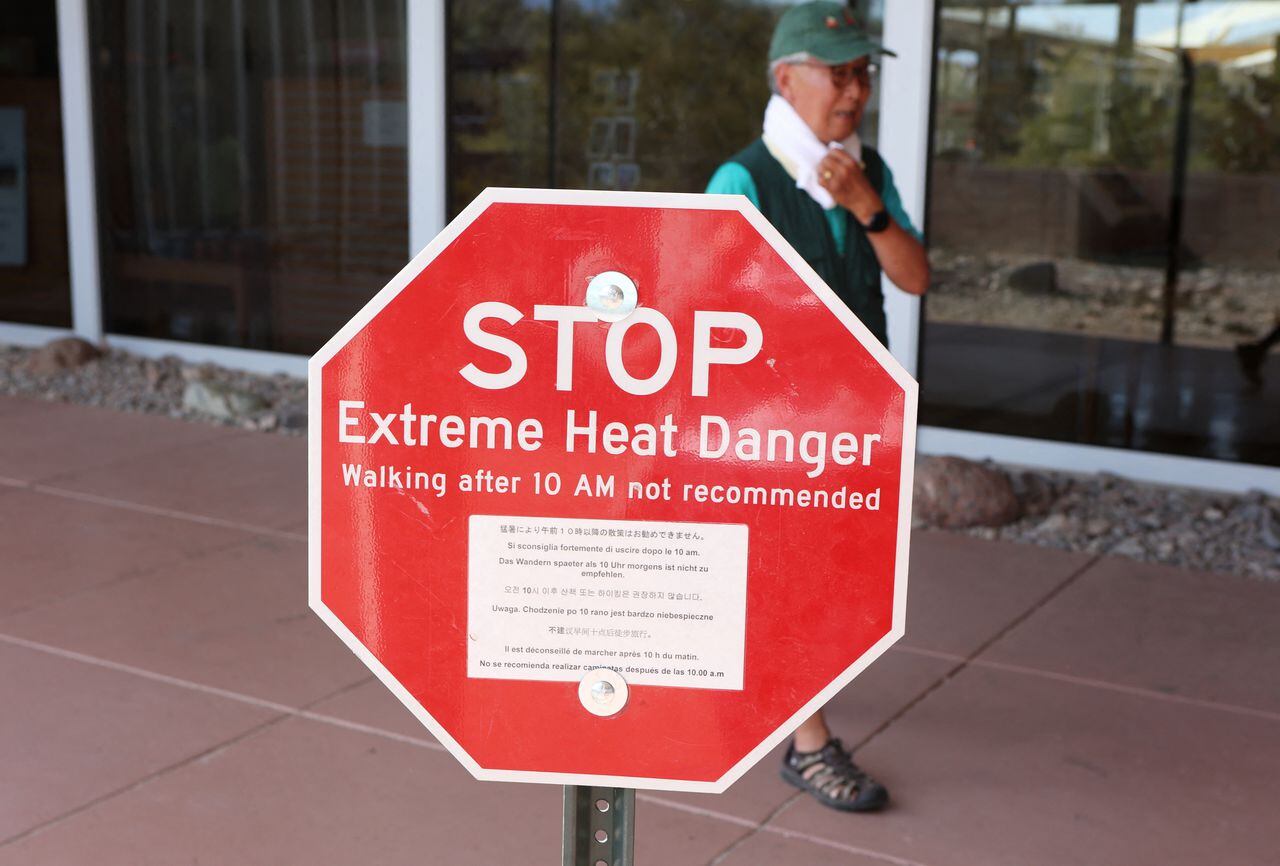 A heat advisory sign is shown at Furnace Creek Visitor Center during a heat wave in Death Valley National Park in Death Valley, California, on July 16, 2023. Tens of millions of Americans braced for more sweltering temperatures Sunday as brutal conditions threatened to break records due to a relentless heat dome that has baked parts of the country all week. By the afternoon of July 15, 2023, California's famous Death Valley, one of the hottest places on Earth, had reached a sizzling 124F (51C), with Sunday's peak predicted to soar as high as 129F (54C). Even overnight lows there could exceed 100F (38C). (Photo by Ronda Churchill / AFP)