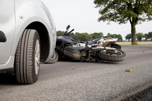 Motorbike Accident on the road with a car