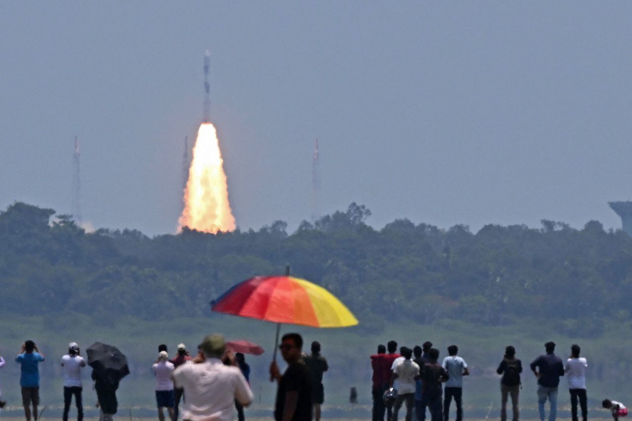 eople watch as the PSLV XL rocket carrying the Aditya-L1 spacecraft, the first space-based Indian observatory to study the Sun, is launched from the Satish Dhawan Space Centre in Sriharikota on September 02, 2023. The latest mission in India's ambitious space programme blasted off September 2, on a voyage to the centre of the solar system, a week after the country's successful unmanned Moon landing. Aditya-L1 is carrying scientific instruments to observe the Sun's outermost layers, launching shortly before midday to begin its four-month journey. (Photo by R. Satish BABU / AFP)