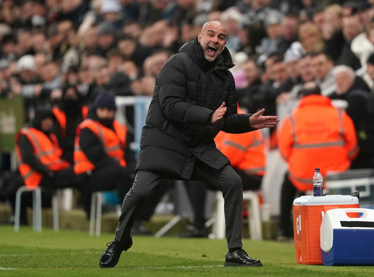 Manchester City manager Pep Guardiola gestures on the touchline, during the English Premier League soccer match between Newcastle United and Manchester City, at St. James' Park, in Newcastle upon Tyne, England,  Saturday, Jan. 13, 2024. (Owen Humphreys/PA via AP)