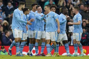 Manchester City's Phil Foden celebrates with teammates after scoring his side's fourth goal during the English FA Cup third round soccer match between Manchester City and Huddersfield Town, at the Etihad stadium in Manchester, England, Sunday, Jan. 7, 2024. (AP Photo/Dave Thompson)