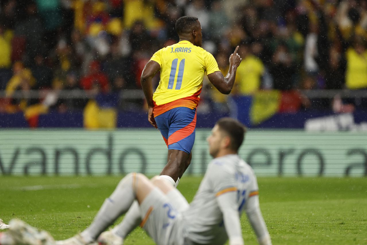Colombia's midfielder #11 Jhon Arias (up) celebrates scoring his team's second goal during the international friendly football match between Romania and Colombia at the Metropolitano stadium in Madrid on March 26, 2024. (Photo by OSCAR DEL POZO / AFP)